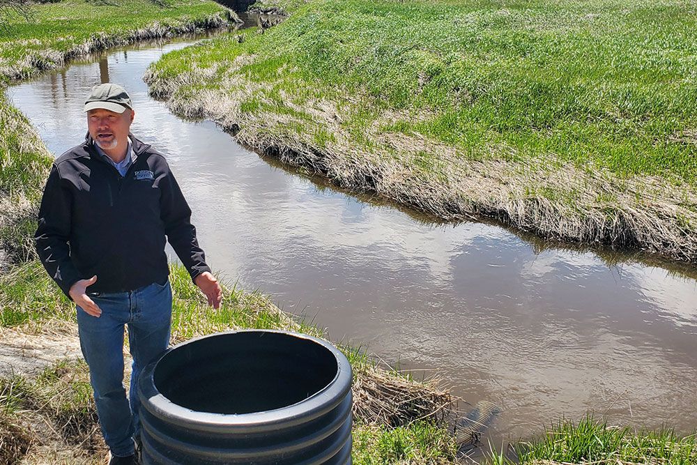 This photos shows John Rodger, on his farm, at the structure, just before the outlet to Judges Creek Drain, near Lion's Head.