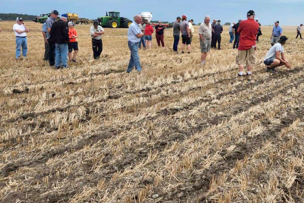 Attendees look at the strip-till demonstration at Huron County Ploughing Match in August of 2024.